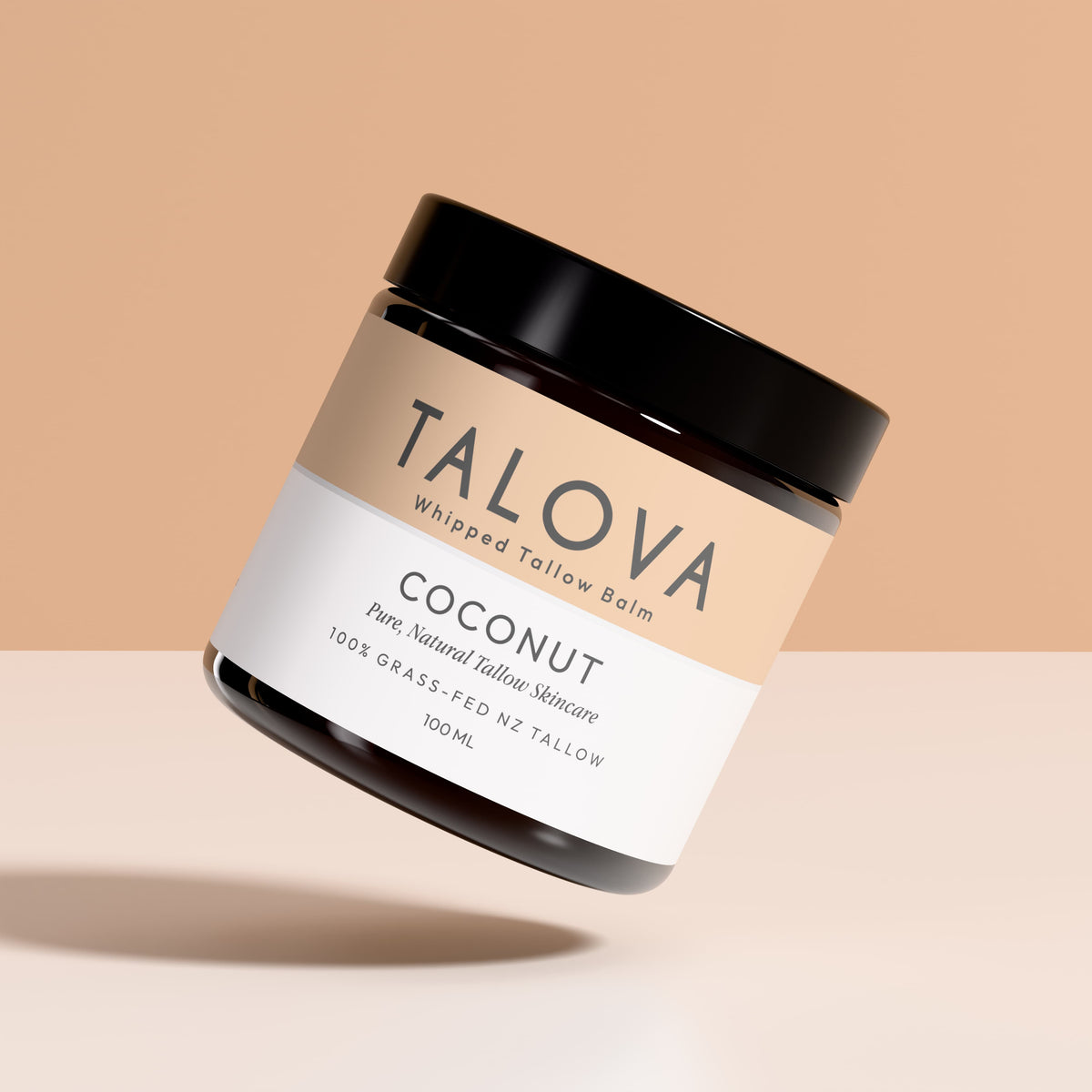 Talova Coconut whipped tallow balm jar on a beige background